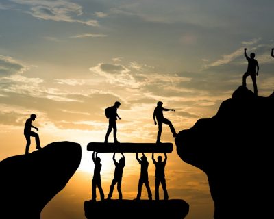 Group of people on peak mountain climbing helping team work , tr