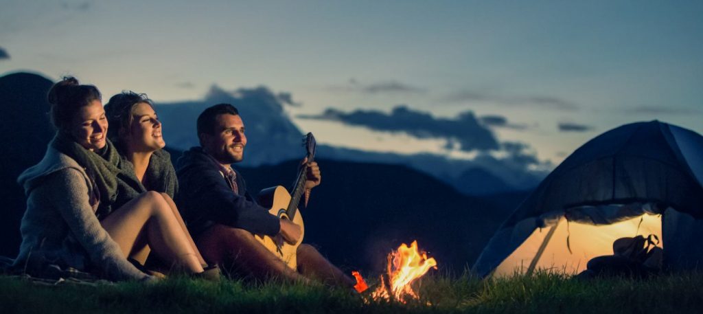 friends enjoying a campfire in temperate north america