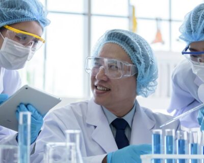 Asian senior scientist male researching and working with chemical hazards