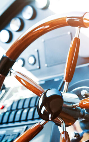 Steering wheel on luxury yacht.