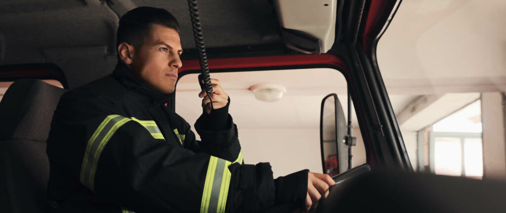 Hazardous goods driver using radio set while driving fire truck