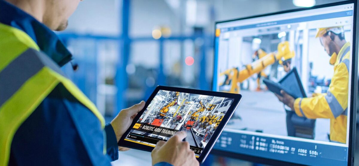 Worker engaging with scenario-based safety training using a tablet in a high-tech facility.
