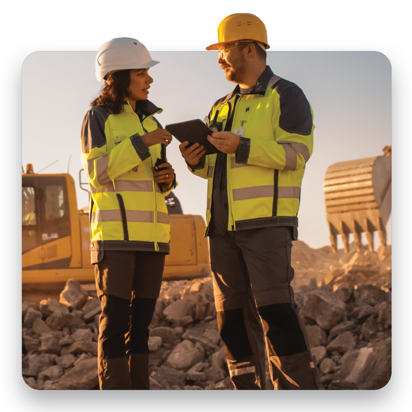Safety professionals reviewing workplace data on industrial site